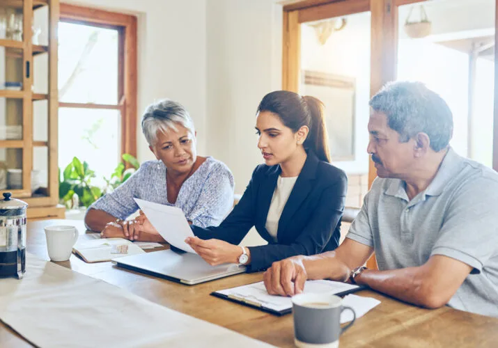 Shot of a mature couple getting advice from their financial consultant at home